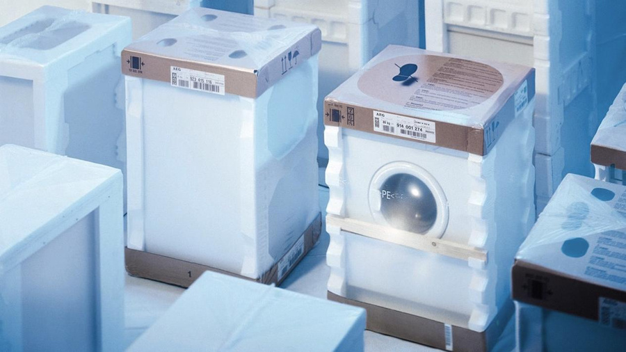 Home appliances in a safe transport packaging, made with a MSK shrink wrapping machine
